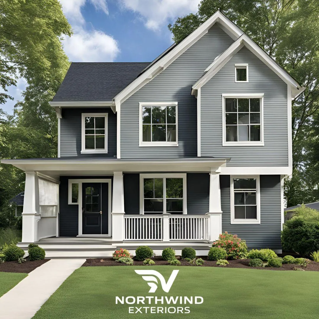 "Freshly renovated home with new siding surrounded by snow, showcasing warmth, durability, and curb appeal