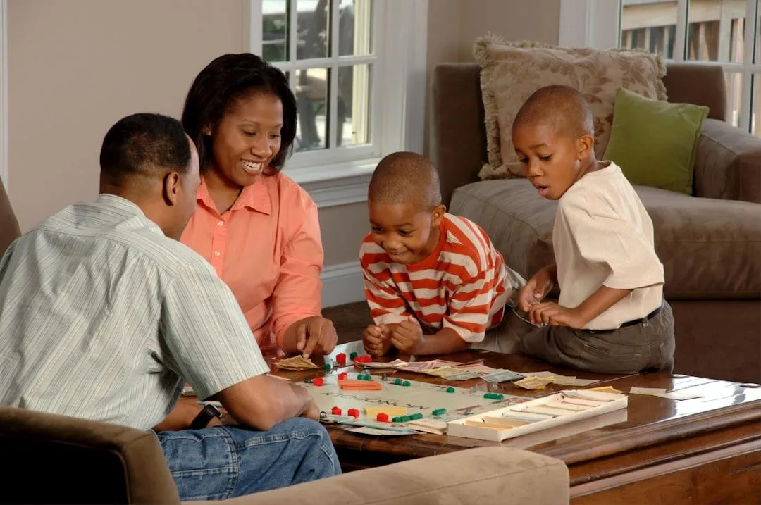 Parent playing game with children.