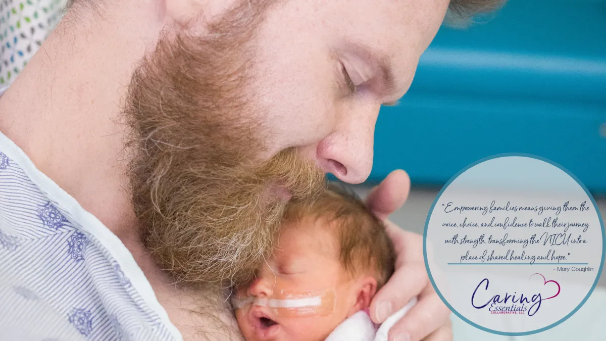 father holding his baby