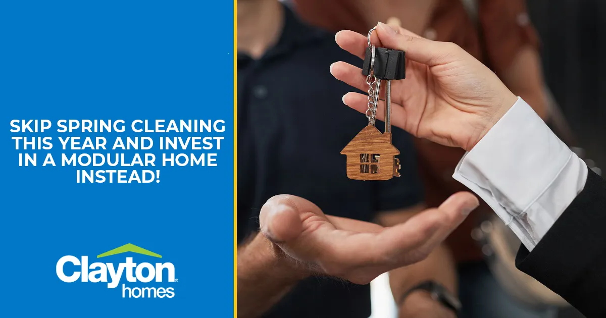 Man and woman smiling while they receive keys to their new home. 