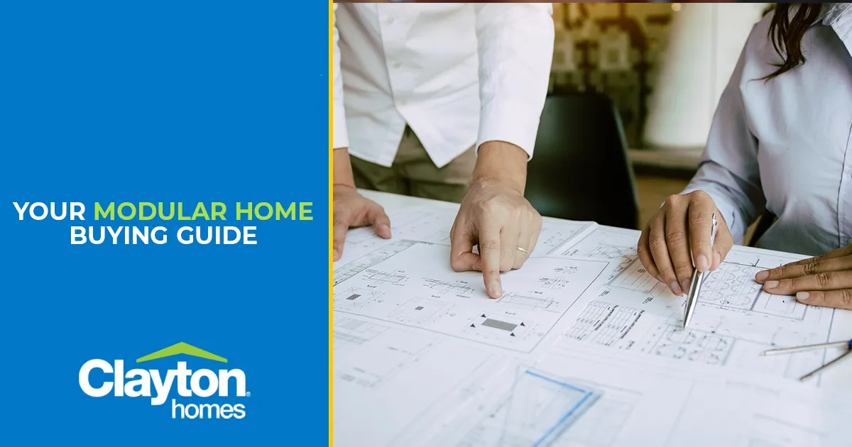 n engineer shows a client blueprint options for a home.