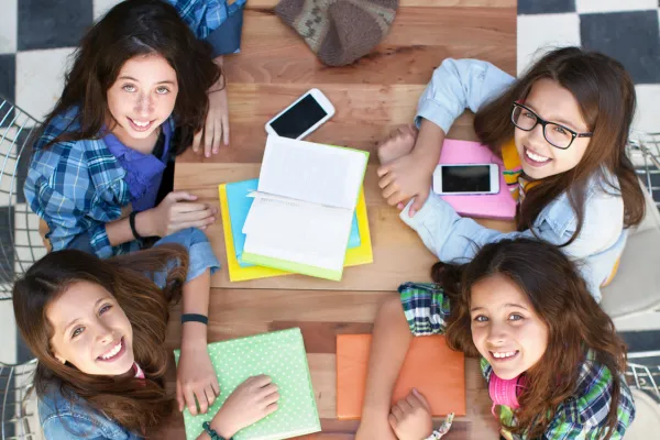 friends in café studying together.