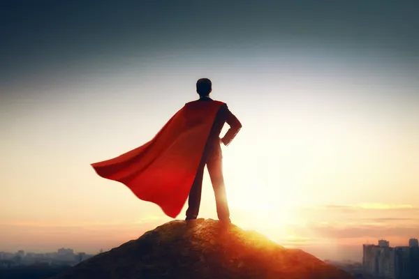 Superhero on top of the world with meme caption "how it feels to find your dream customers