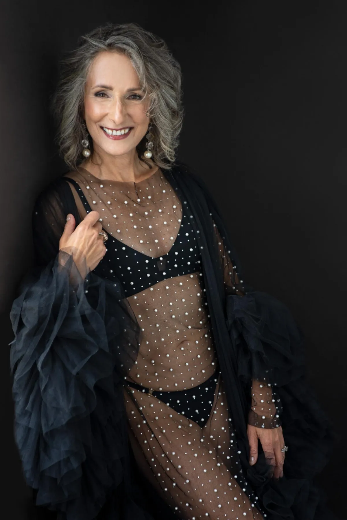 boudoir photograph of confident woman over 50 by London Ontario boudoir photographer Anita Watkins from Red Door Boudoir