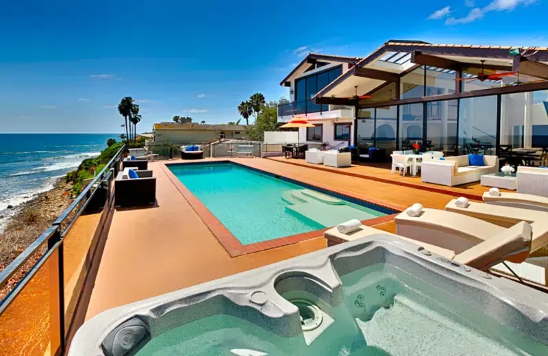 Beautiful beachfront vacation rental in Orange County with ocean views and sunset backdrop