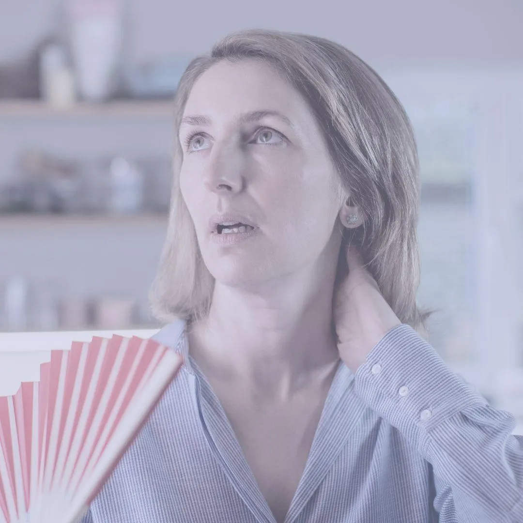 Women using a fan to cool down a hot flush