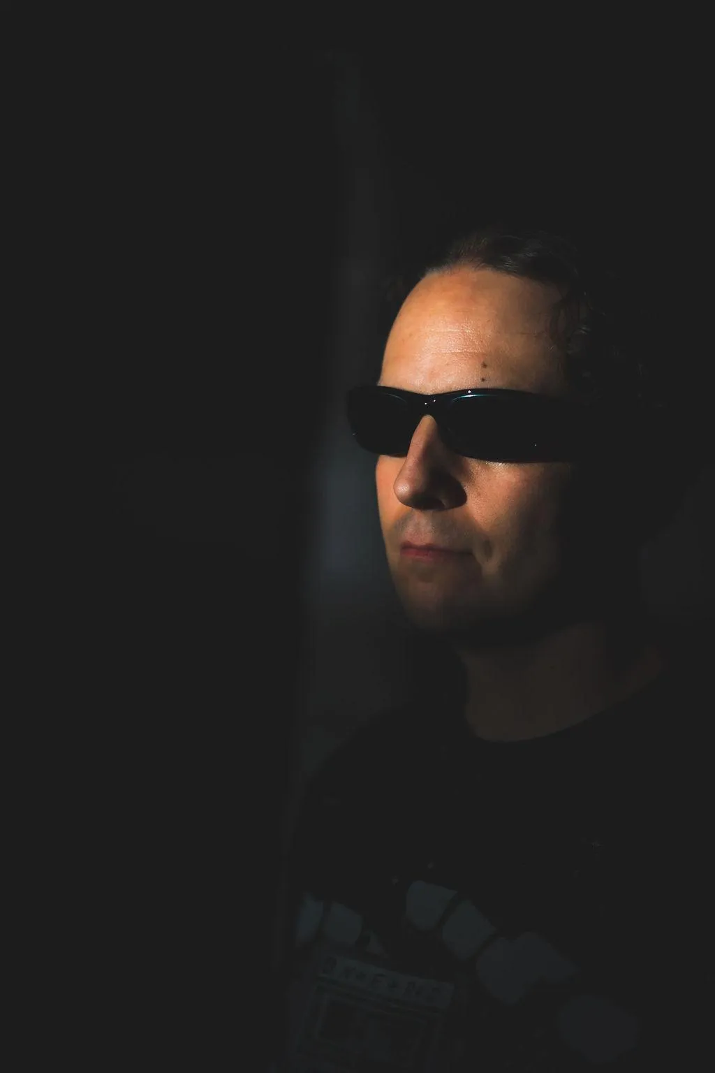 Main GrayBeat artist photo with turned head and sunglasses. cool demeanor.
