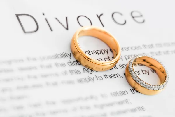 divorce papers and rings on it