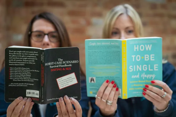 Image of Rachel Allen and Samantha Poole reading dating books