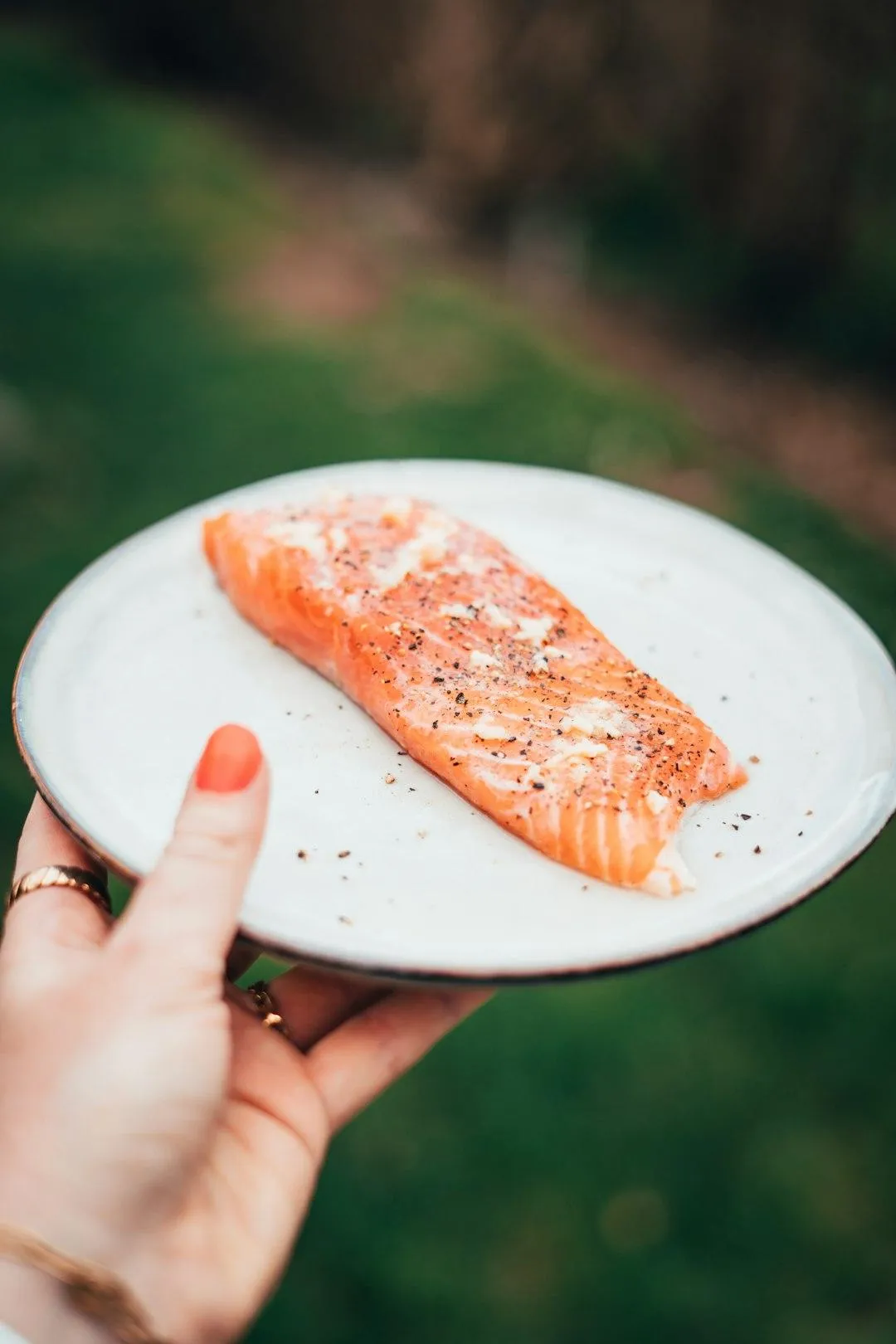 Plate of salmon with vegetables representing an anti-inflammatory meal for women on GLP-1 medication during perimenopause.