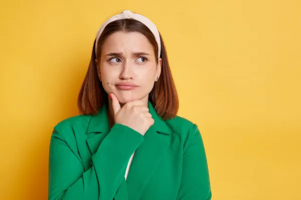 Woman looks to the side quizzically