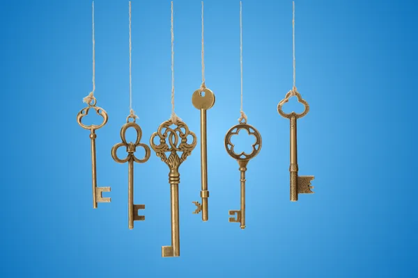 6 keys hanging against a blue background