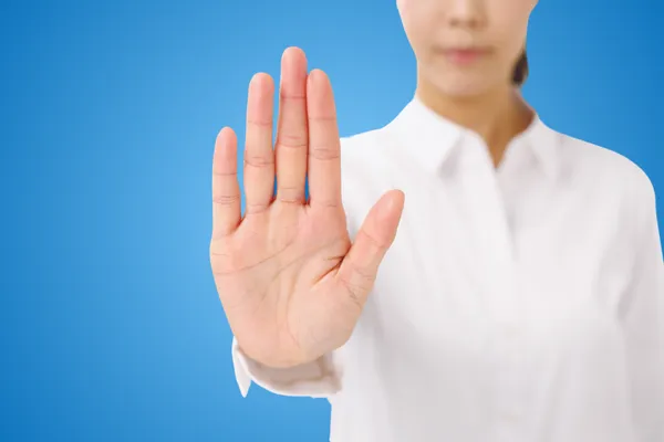 A woman holding hand up to say stop