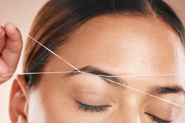 perfectly shaped eyebrows after threading at a top salon in Plymouth.
