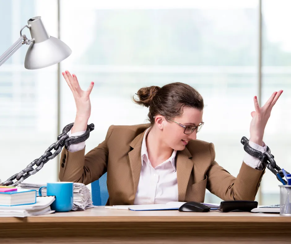 woman chained to desk
