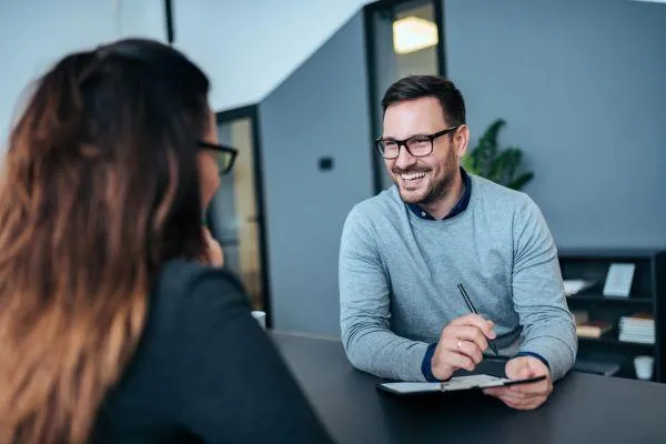 Man interviewing a woman
