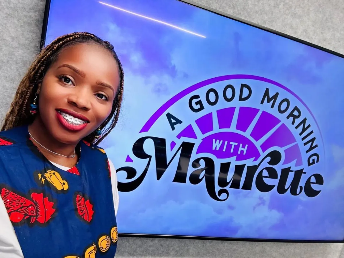 A collage featuring Koach Keisha at iHeart Radio on the show 'Good Morning with Maurette.' The main image showcases Koach Keisha smiling with braces, wearing a vibrant African-print outfit, standing in front of a large screen displaying the show's logo with purple and black text. Overlaying the main image are three smaller photos framed in a filmstrip style: one of Koach Keisha posing with a man with a full beard and glasses, another of her standing in a hallway with a woman dressed in denim, and a third where both are in front of the iHeart Radio logo. The text 'Koach Keisha with iHeart Radio' is prominently displayed in bold, colorful letters at the bottom.