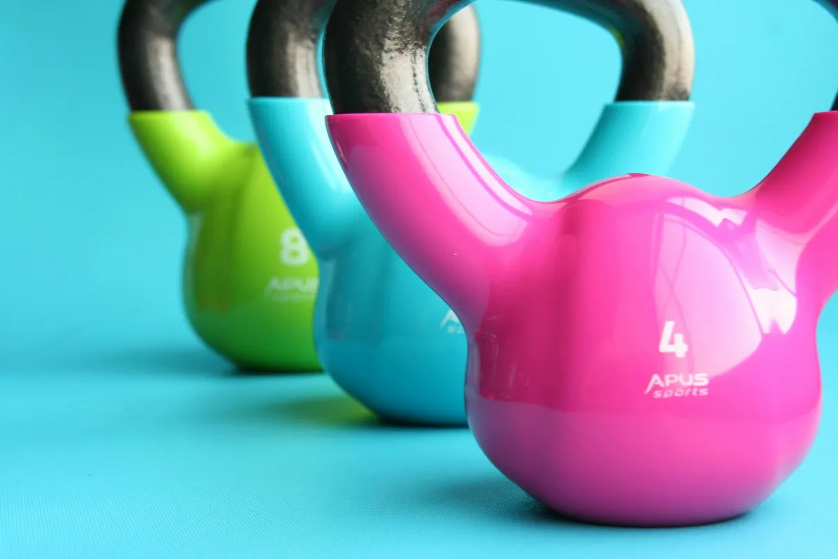 Photo by Pixabay: https://www.pexels.com/photo/green-blue-and-pink-kettle-bells-on-blue-surface-221247/
