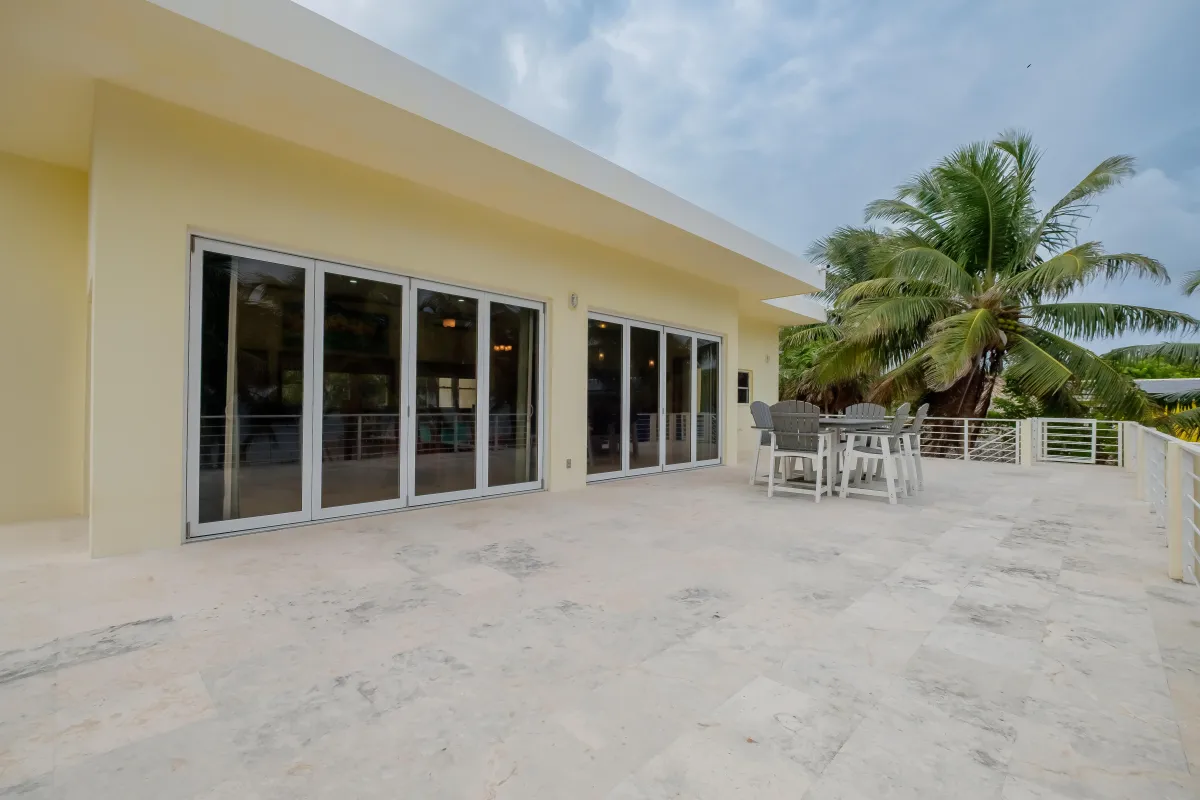 Table for six on the balcony of this Ambergris Caye Vacation Rental