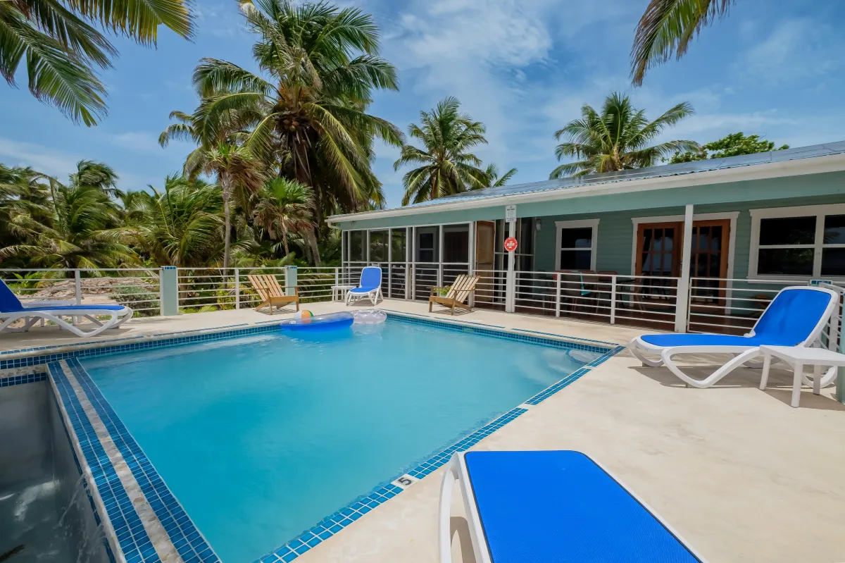 Private pool with pool chairs and floats