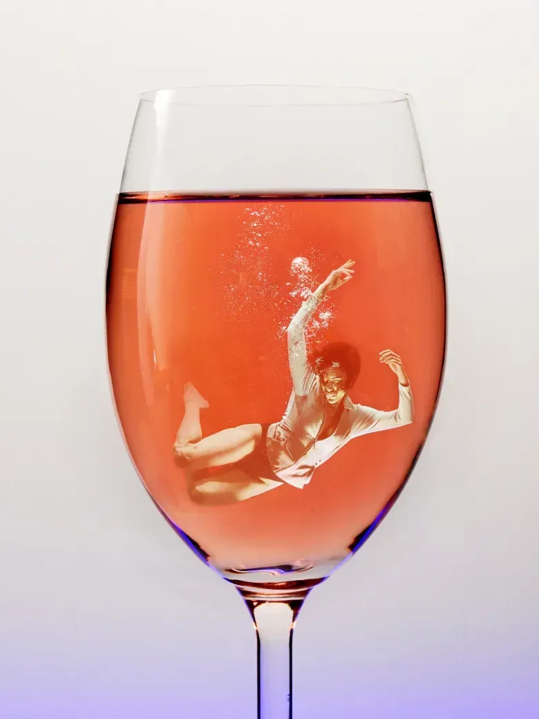woman drowning in alcohol