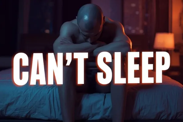 man struggling to sleep