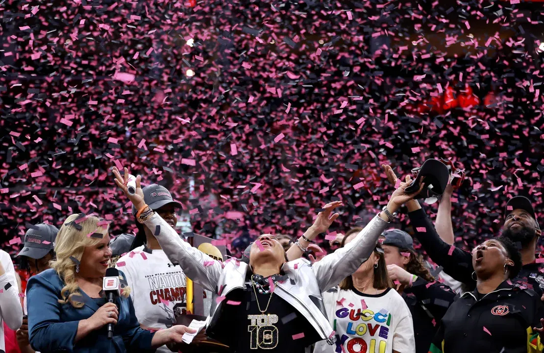 Coach Dawn Staley celebrating her third National Championship in seven years.