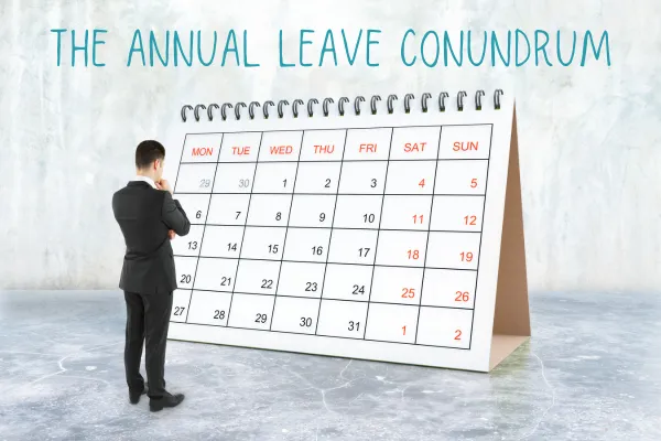 Man in suit looking at a giant calendar and thinking