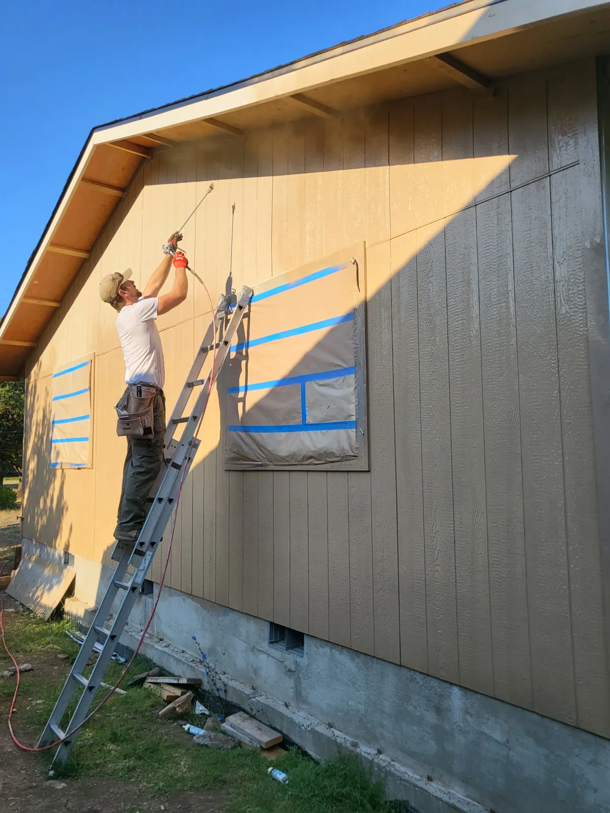 Exterior siding and window trim painting in Oregon home by Parker Built Construction team