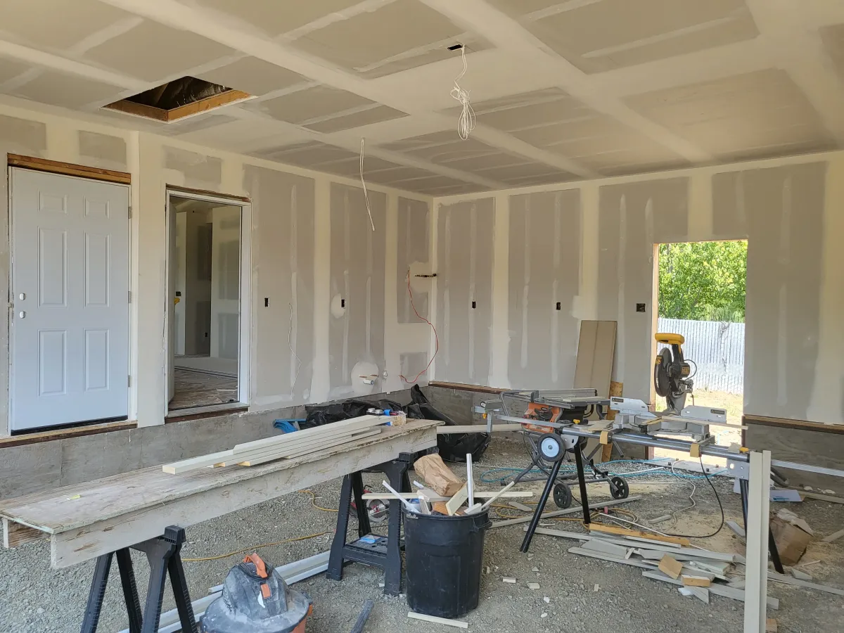 Drywall installation and ceiling finishing inside a residential home renovation in Oregon by Parker Built Construction