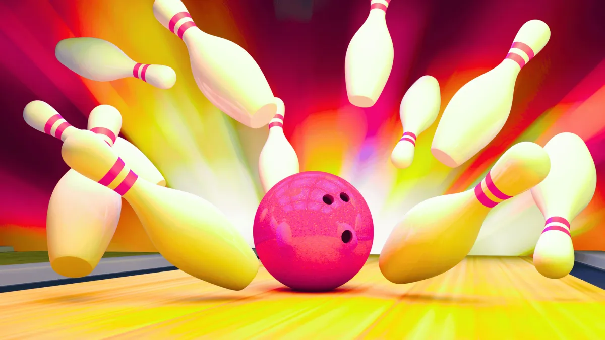 Bowling strike with silly face on ball.