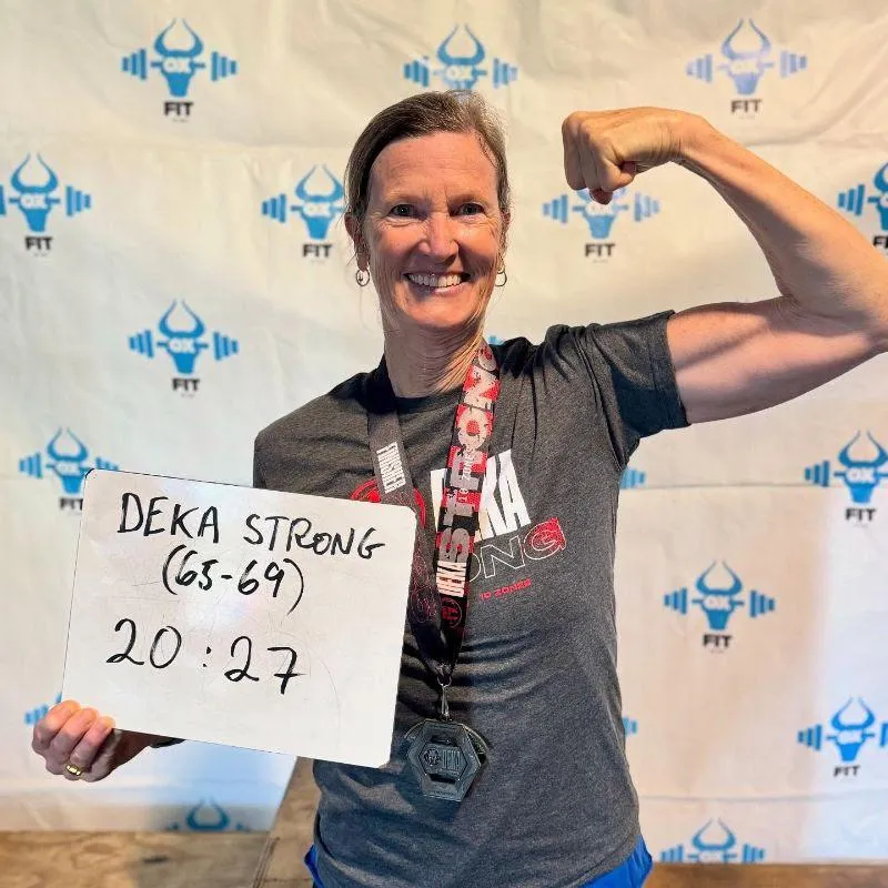 woman flexing after winning medal At 67, She’s Proud to Make People Say, ‘Look at That’