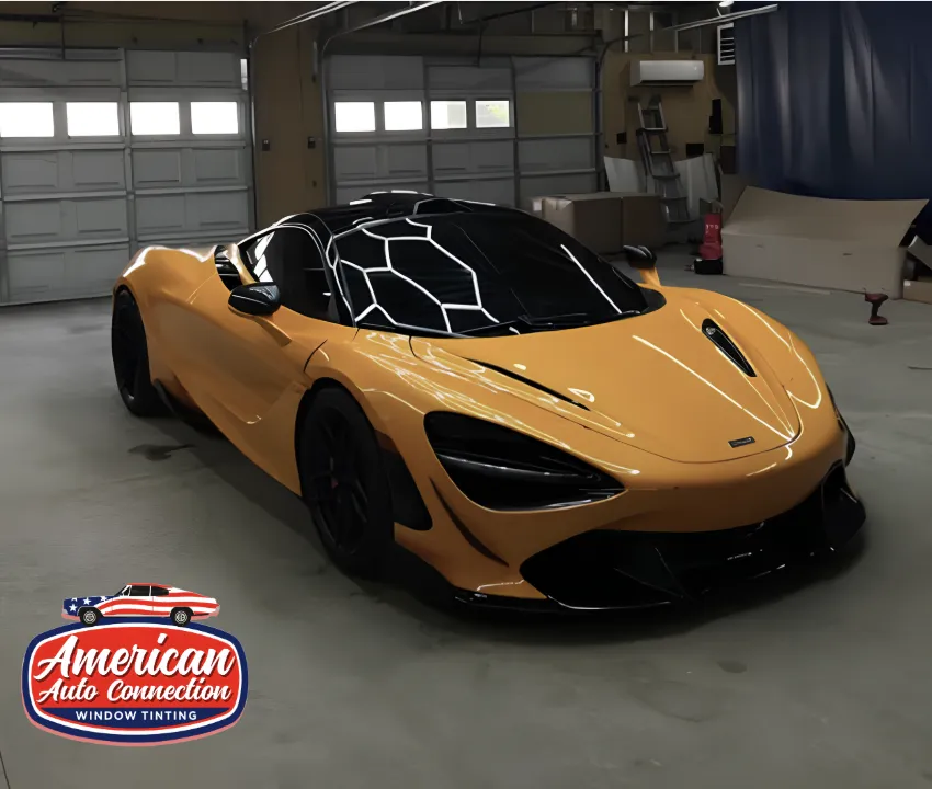 sports car with completed tinted windows under bright lights.