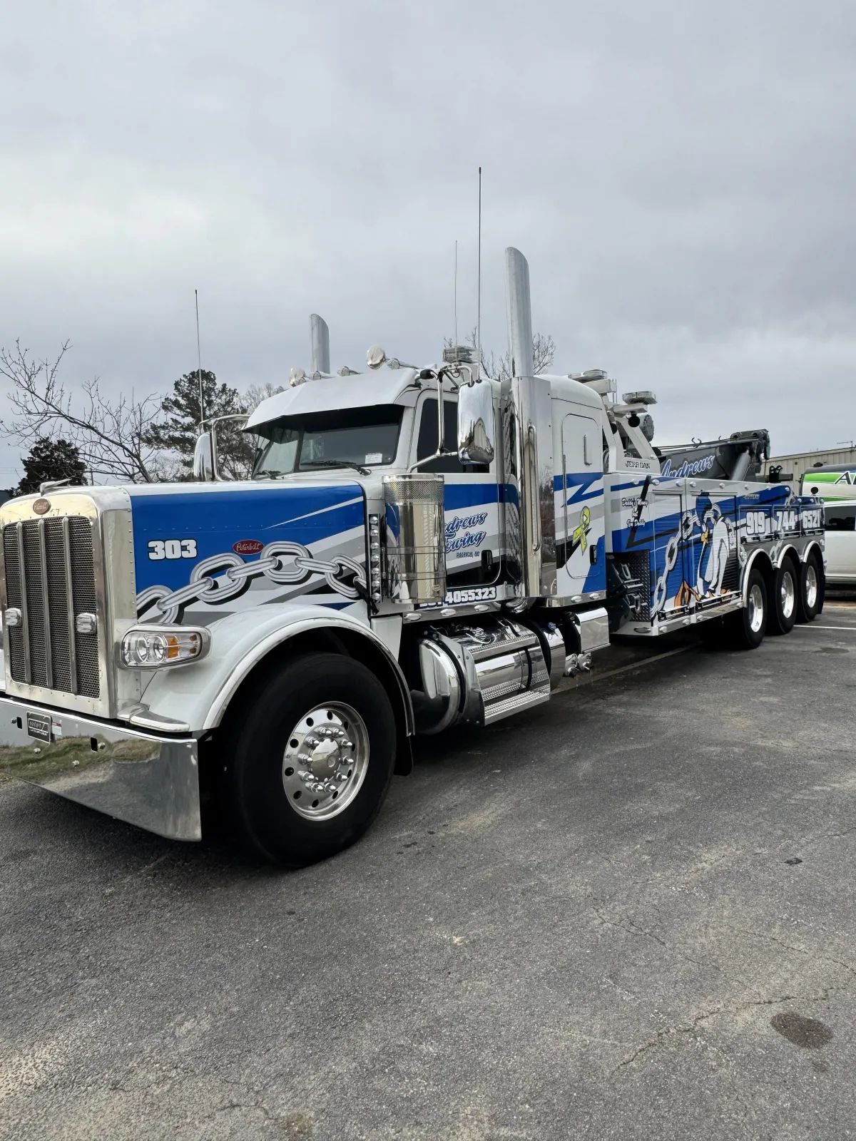 Fleet of construction trucks with tinted windshields and side windows in Clayton NC.