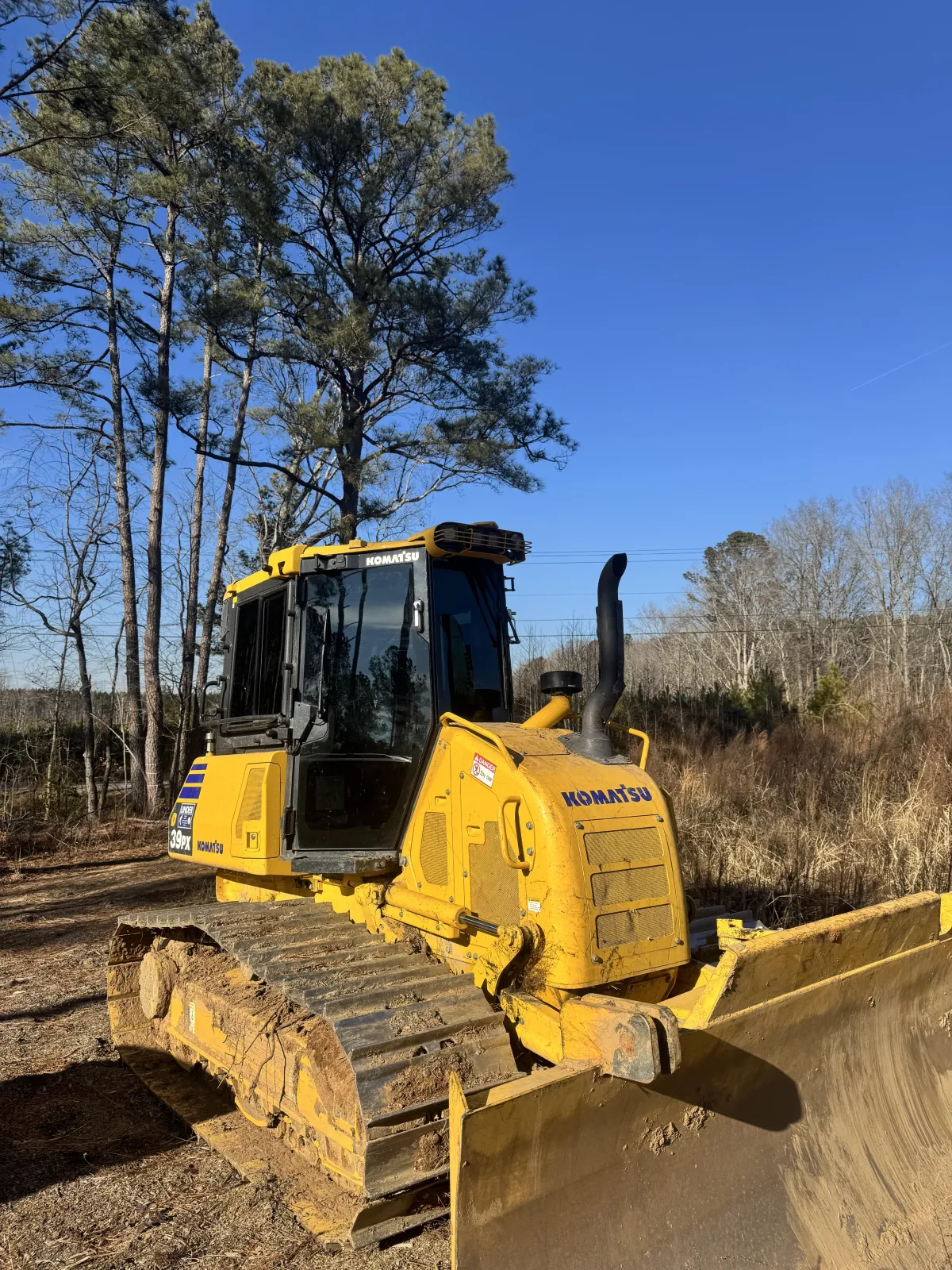 Bulldozer on construction site with window tint in Clayton, NC