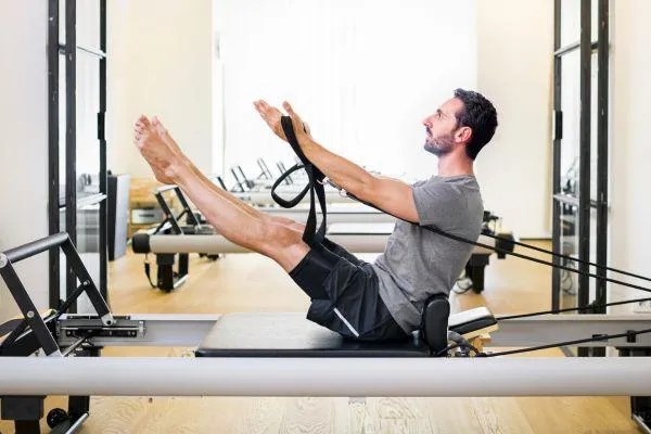 man using clinical reformer blog post
