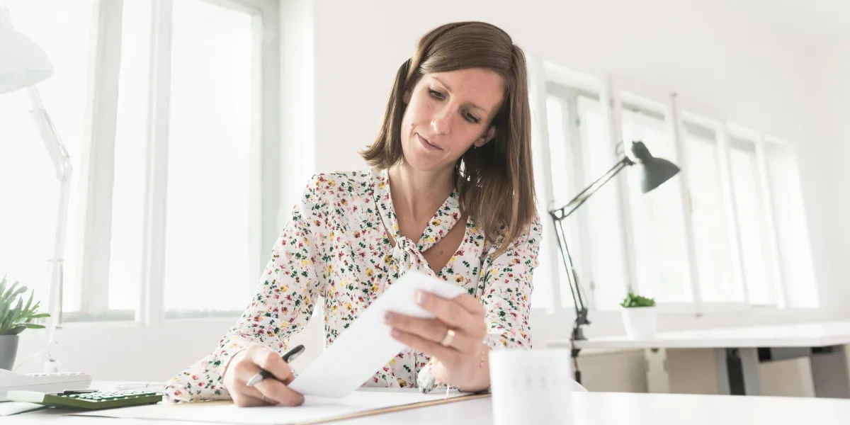 Lady checking receipts