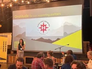 Leah Wong Ashburn speaking at the Asheville Business Summit VIP Dinner at the Highland Brewery