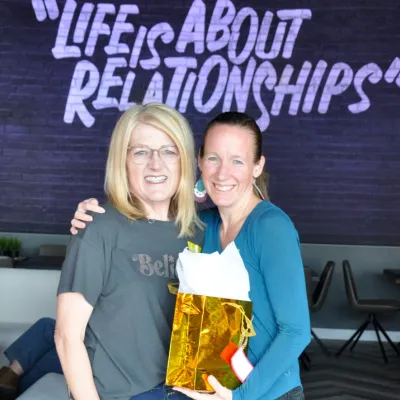 Stacie Harris with attendee at the Light of Your Legacy event.