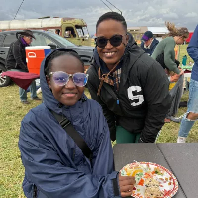 Single mom and daughter enjoy dinner at the corn maze event.
