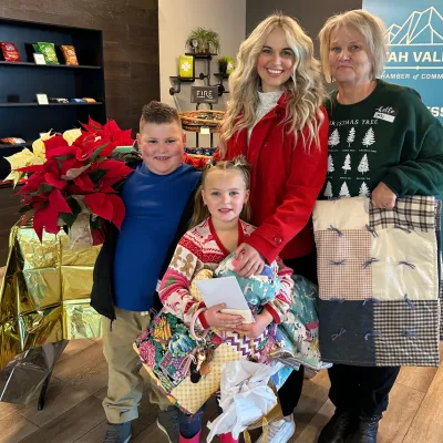 Annie and family loaded with gifts after the Light of Your Legacy event.