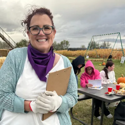 Corn Maze volunteer smiles.