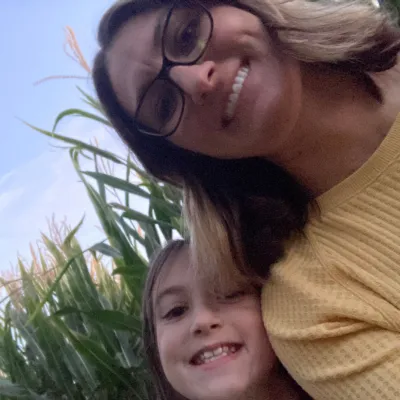 Single mom and daughter themselves at the corn maze event.