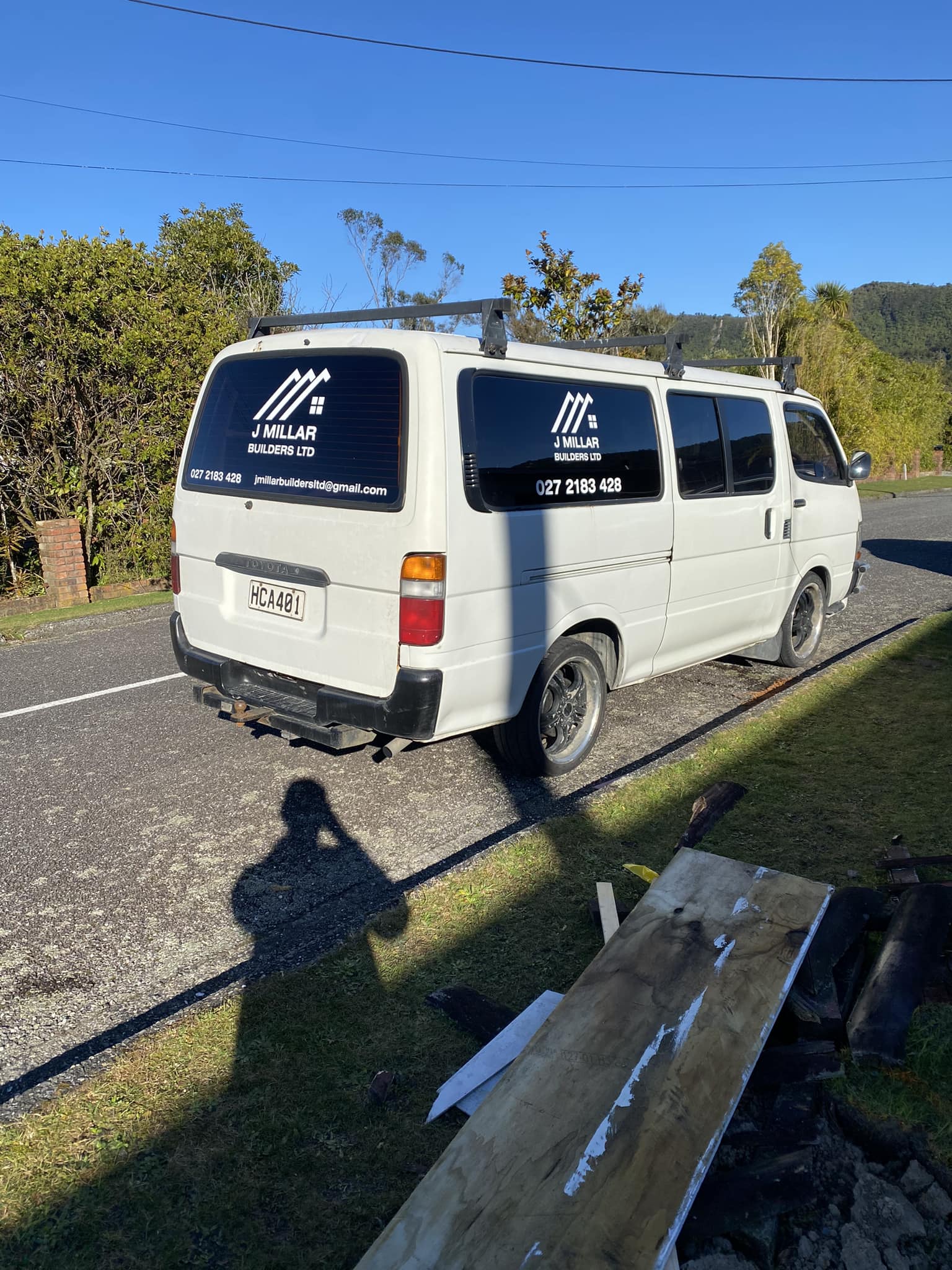 J Millar Builders Ltd work vehicle on residential roofing project West Coast
