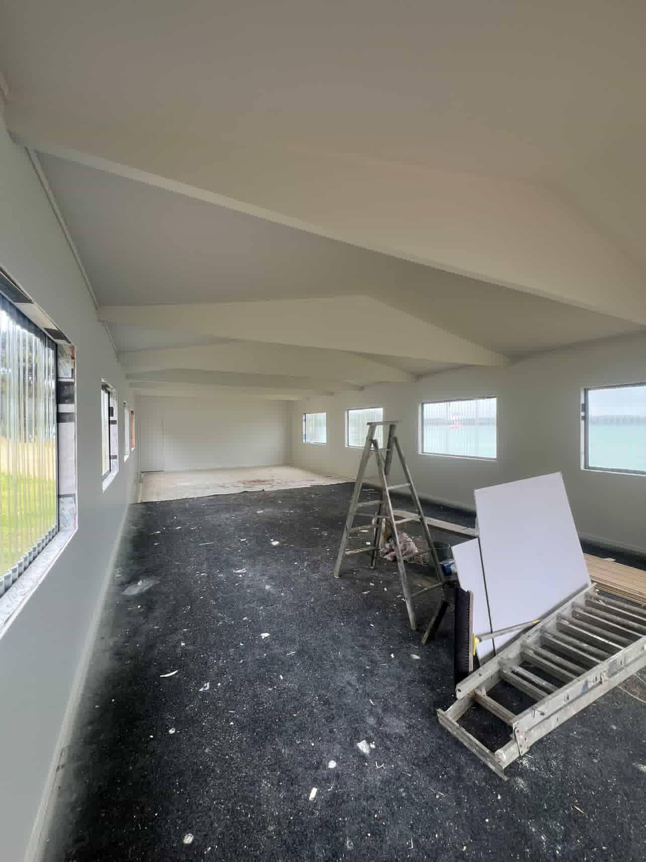 Interior house painting in progress open plan room Far North New Zealand