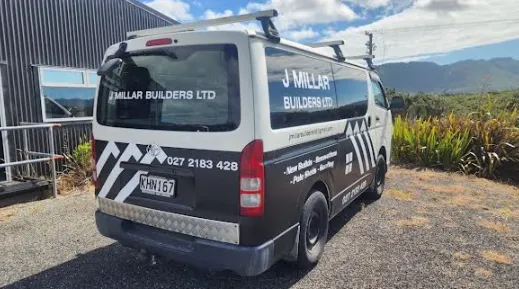 J Millar Builders Ltd branded work van parked at residential building site Greymouth