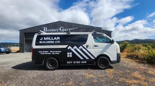 J Millar Builders Ltd signwritten van at completed building project Greymouth