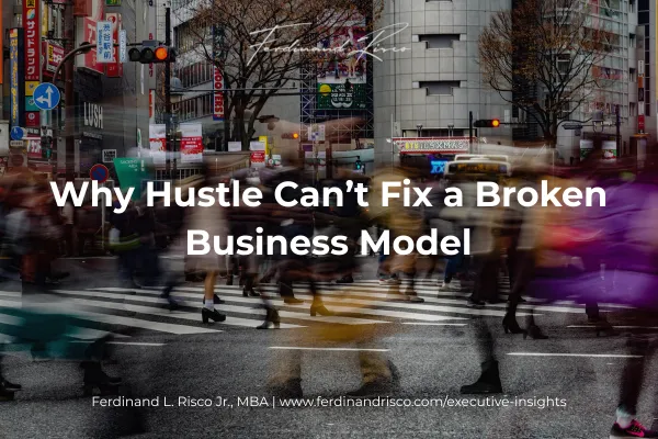 Crowd of people rushing through a city crosswalk, symbolizing hustle culture and burnout in modern business.