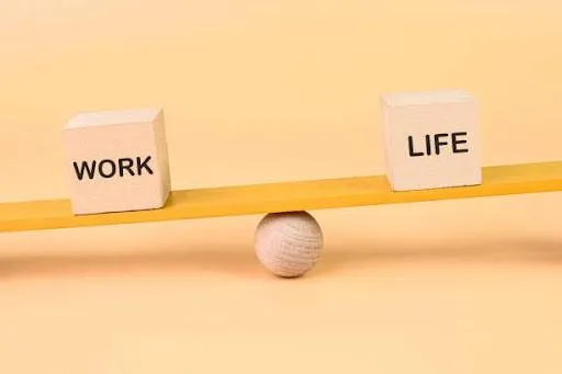 A scale balancing two objects, one labeled "Work" and the other labeled "Life." This image visually represents the importance of finding balance in saying yes or no to work and personal life activities.