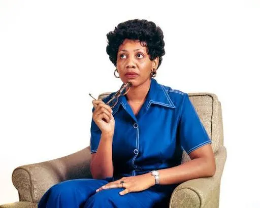 1970s A Worried African-American Woman Thinking About Some of her Childhood Experiences Sitting In Chair Holding Eyeglasses To Chin. (Photo By H. Armstrong Roberts/Getty Images)